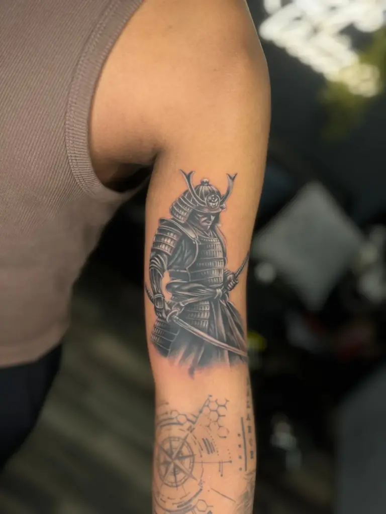 Black and grey realism samurai warrior tattoo on the upper arm, Rays Tattoo Studio