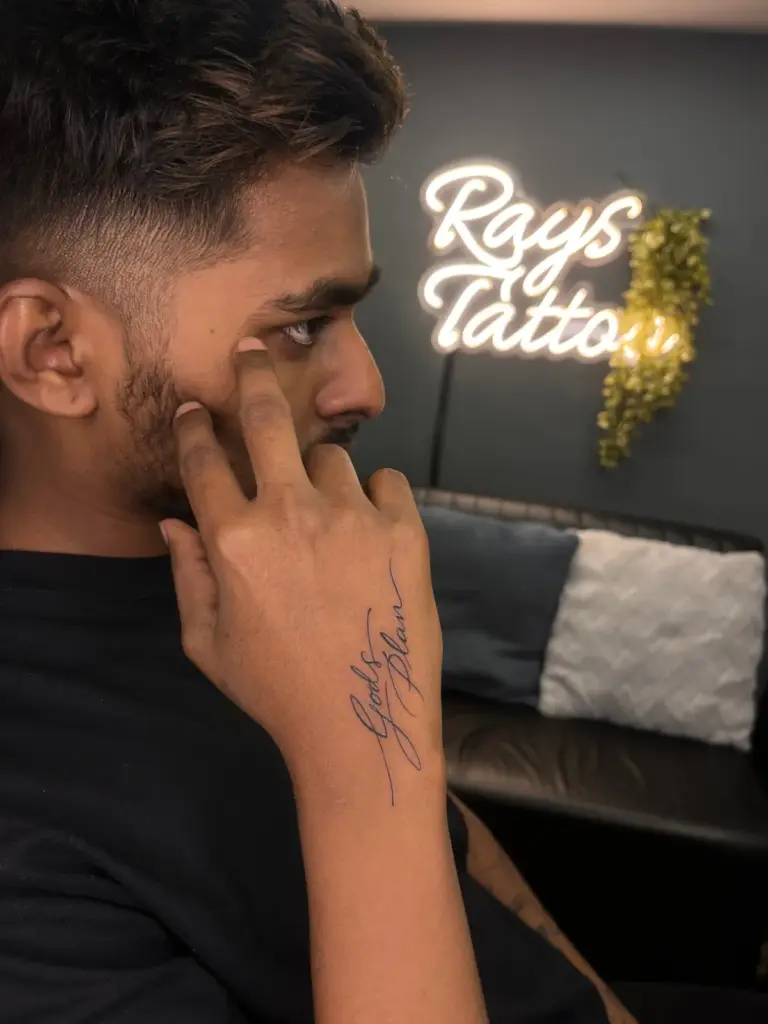 Fine-line "Gods Plan" script tattoo on the side of the hand, Rays Tattoo Studio Kandivali